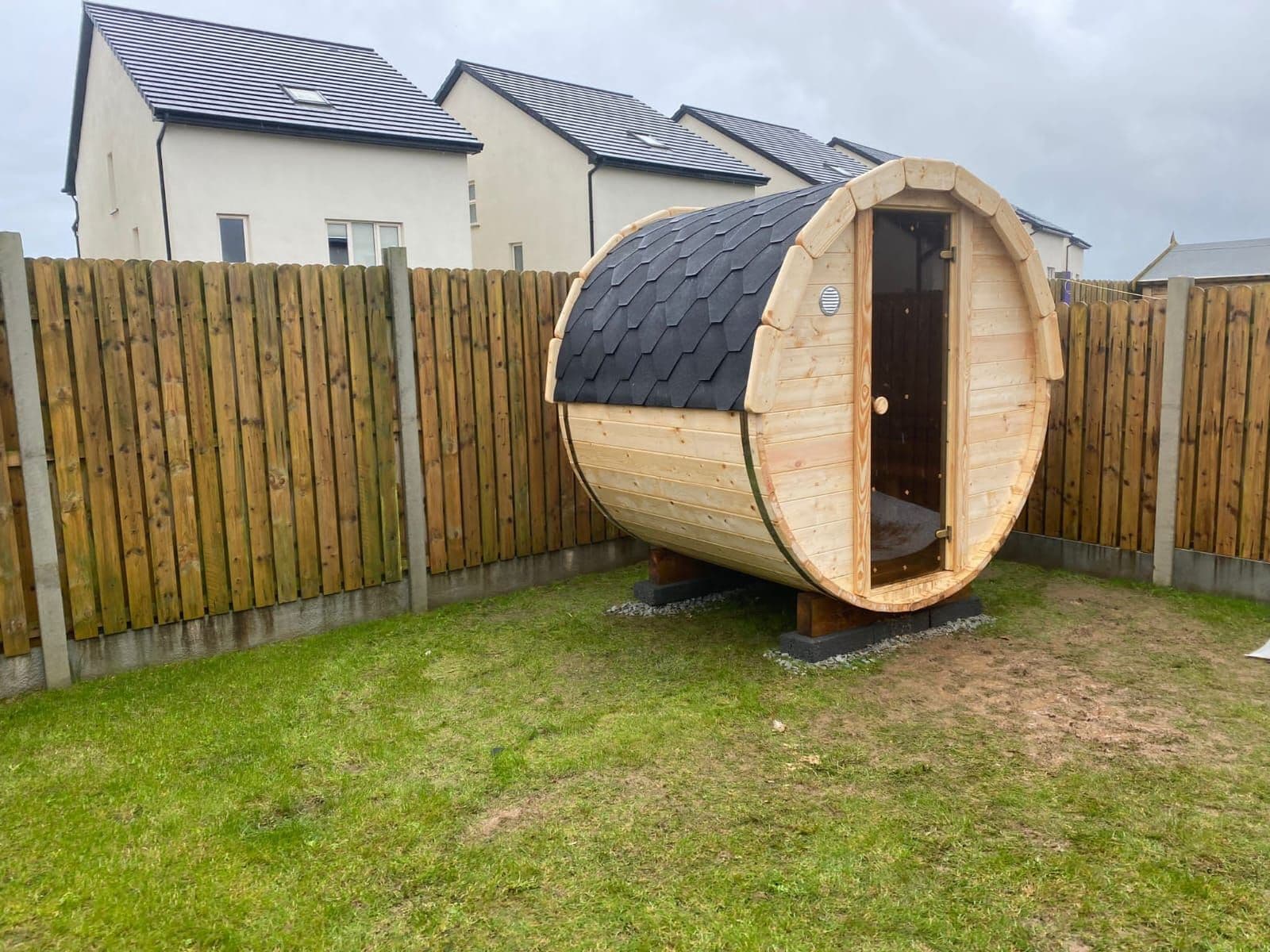 Premium thermowood barrel sauna showing natural wood grain and durability