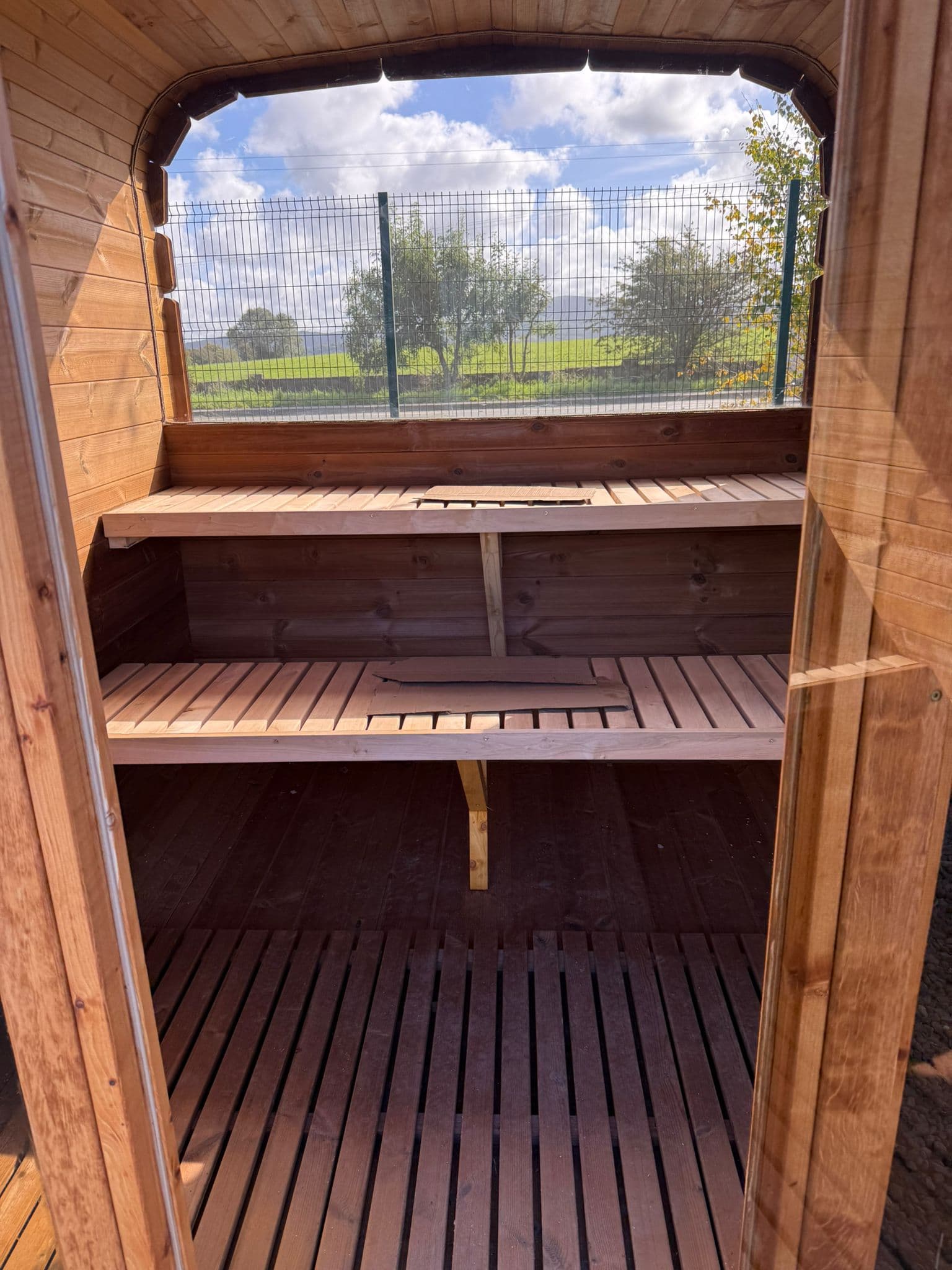 Glamping site round wooden barrel sauna