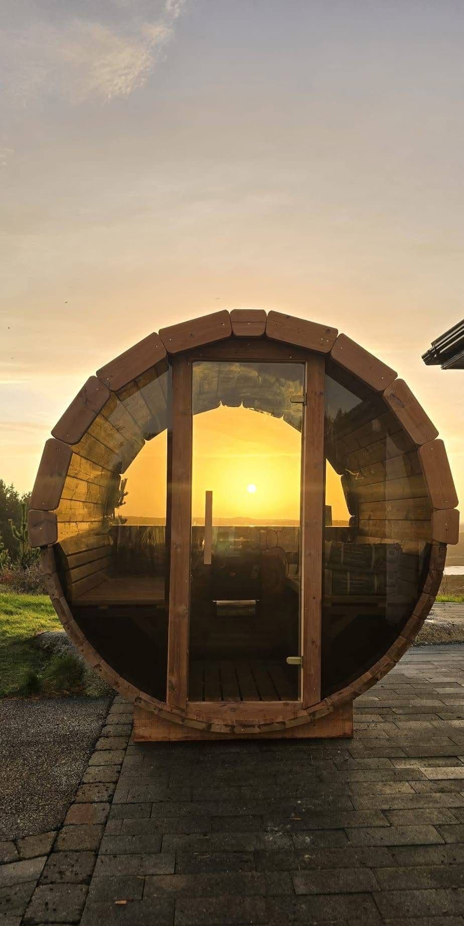 Backyard barrel sauna with panoramic window