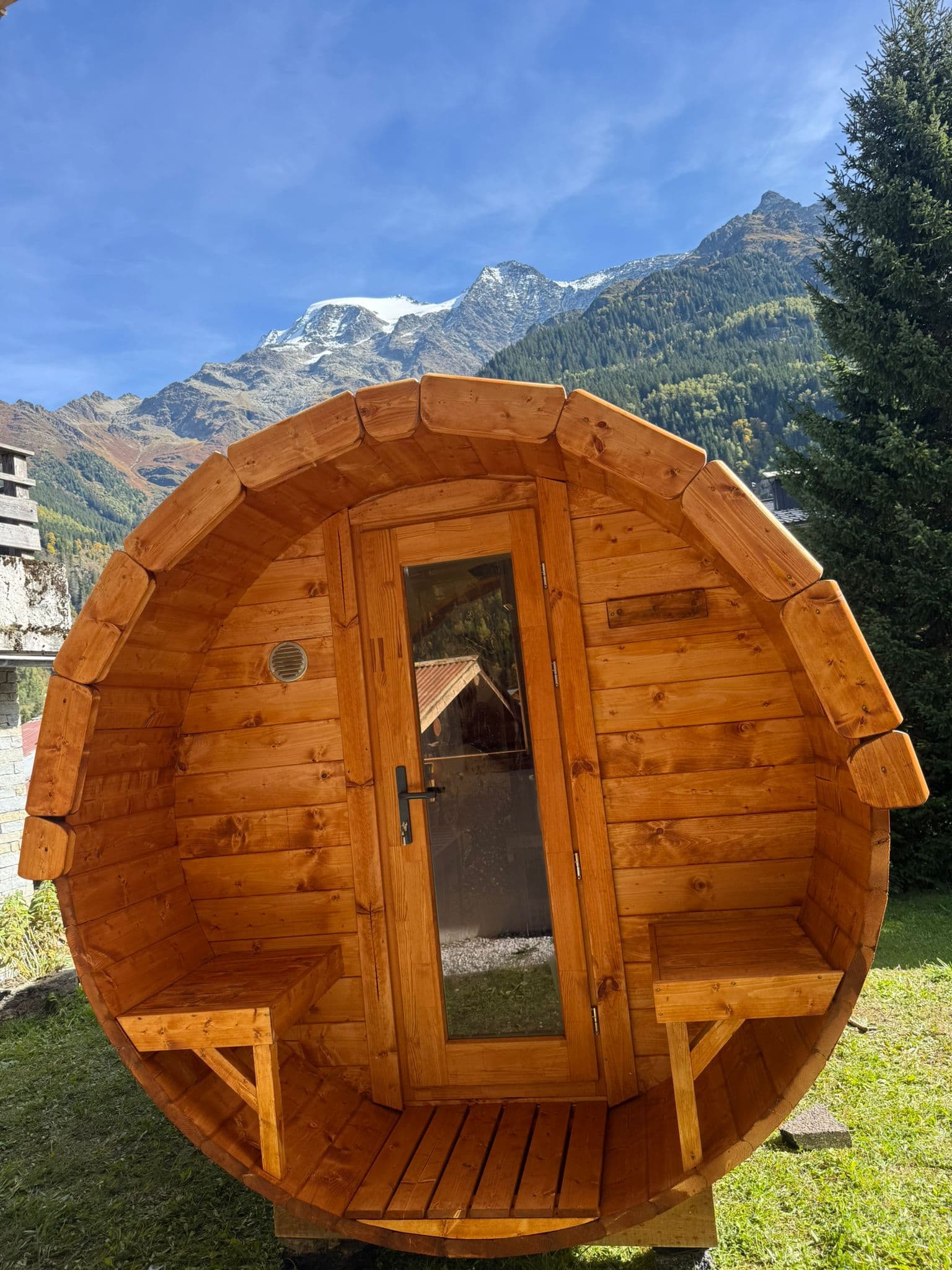 Electric heater inside outdoor barrel sauna