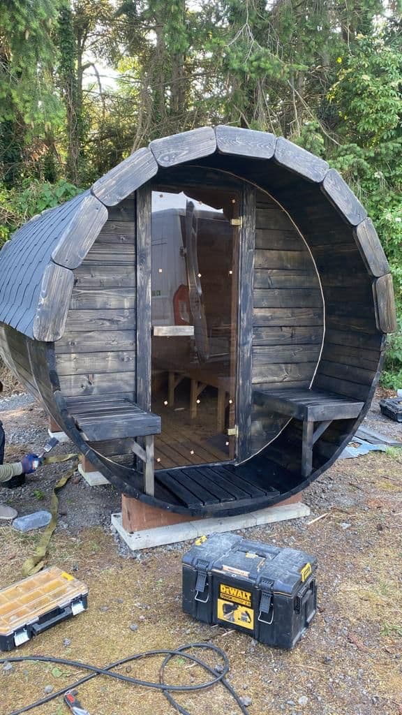 Flat-pack barrel sauna components ready for assembly